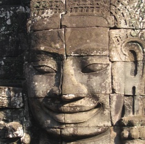 A smiling face of one of the 54 four-faced towers at Bayon in Angkor Thom 
