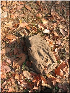 03-01-03 Baphuon --- A ruin stone with a relief of a hermit.jpg