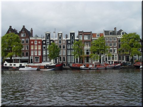 Day 10.05 (Holland)-Pretty facades of old buildings seen in Amsterdam during boat cruise.JPG