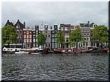 Day 10.05 (Holland)-Pretty facades of old buildings seen in Amsterdam during boat cruise.JPG