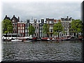 Day 10.05 (Holland)-Pretty facades of old buildings seen in Amsterdam during boat cruise.JPG