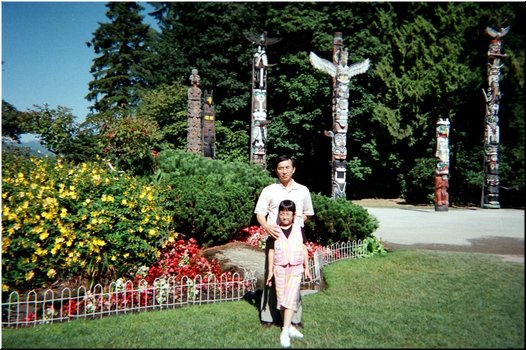 16 In front of some totems in Stanley Park, Vancouver (July 31).jpg