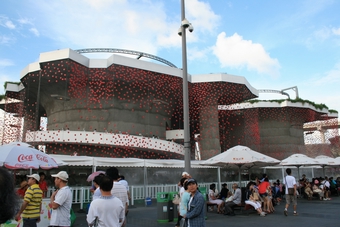 I-2-10-01-Switzerland Pavilion- a building with lots of red decoration glass disks