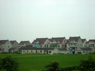I-7-03-01-Uniform modern countryside houses seen on the way to Wuzheng