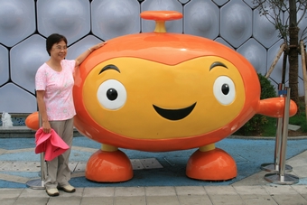 25-Prof. Chang in front of a cartoon figure
