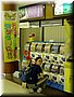 05-05-24 Meimei checking small-thing selling machines in Obihiro Airport.JPG