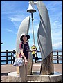 Japan 2024---05-04-07_My wife hitting the bell of XYZ Bell Tower near Sea of Cross.jpg