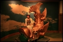 06-03-01 Riding a model of dolphin-like fish on roofs of Tenshukaku.jpg