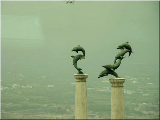 02-04-10 Sculptures of dolphins on two poles in the garden of the hotel.jpg