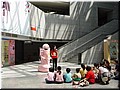 38 Boys and girls in the hall listening to a robot's instruction.jpg