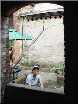 07 A look at the courtyard through a corridor.JPG