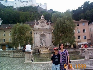 Austria 1999---08-09C 01 At a spot in downtown Sailzburg against Hohensalizburg Castle.jpg