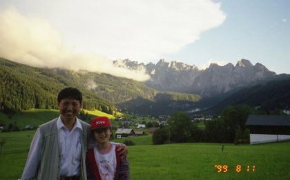 Austria 1999---08-10C 02-03 Group leader Mr. Chen & Meimei against prety scene.jpg