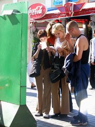D6--05 Russian beauties checking fortune telling results in Arbat Street, Moscow, Russia.JPG