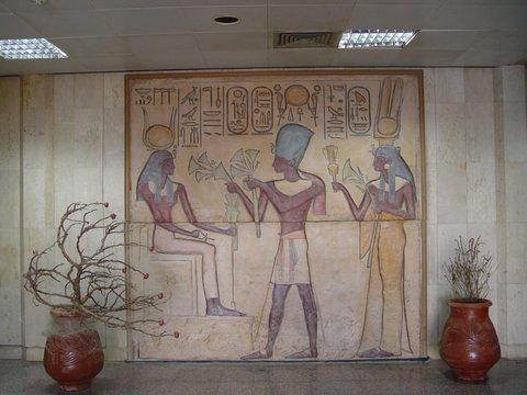 Egypt 2004---D08-01-03 A simulated version of an ancient wall carving in Aswan Airport (Ramses II and Nefertari worshipping Isis).JPG
