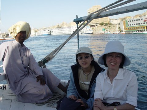 Egypt 2004---D08-06-01 Boat sailing in Nile River in downtown Aswan.jpg