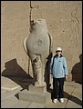 Egypt 2004---D07-03-09 Meimei at the other statue of Horus in front of the Temple (with missing top).jpg
