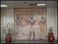 Egypt 2004---D08-01-03 A simulated version of an ancient wall carving in Aswan Airport (Ramses II and Nefertari worshipping Isis).JPG