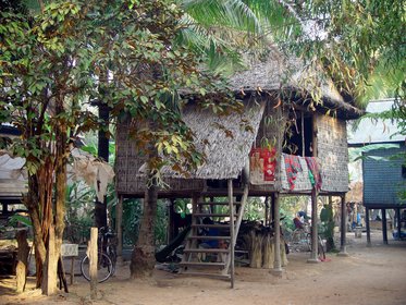 Cambodia 2006 --- Day 04-01 Banteay Srei --- 01 High_legged house seen on way to Banteay Srei.jpg