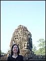 Cambodia 2006 --- Day 03-10 Bayon Revisited --- 03 In front of one of 54 four-faced towers.jpg