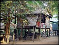 Cambodia 2006 --- Day 04-01 Banteay Srei --- 01 High_legged house seen on way to Banteay Srei.jpg