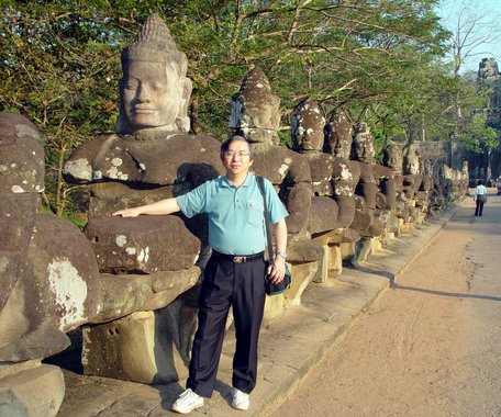Cambodia 2006 --- 08 With a god statue before an entrance of Angkor Thom .jpg