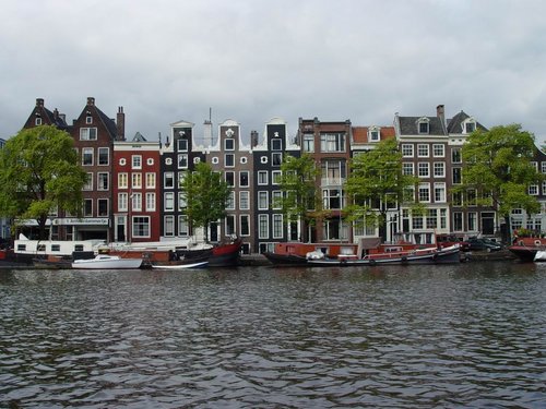 Holland 2005 - Pretty facades of old buildings seen in Amsterdam during boat cruise.JPG