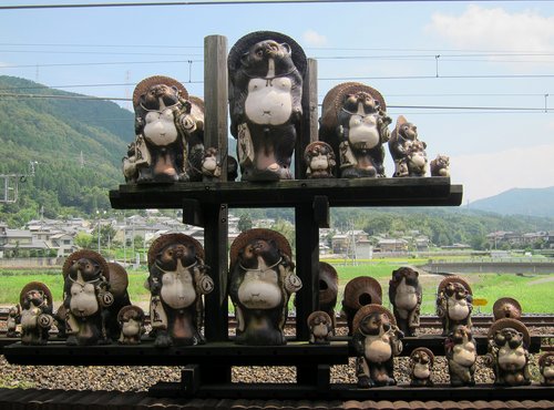 Japan 2015---09_04-2(Torokko train)-19_Lots of Tanuki Dolls seen at Kameoka Station.JPG